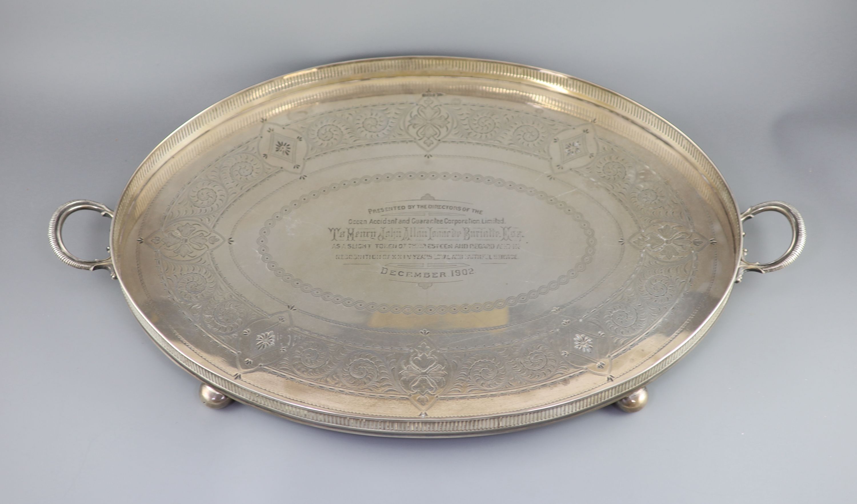 An Edwardian silver two handled oval tea tray, c.1901, by Walker & Hall